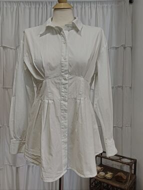 White Button-Front Pleated peplum shirt.